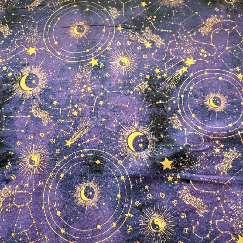 Purple cotton flannel fabric with golden zodiac constellations, stars, suns, and moons, brushed for softness, 44" wide – perfect for quilts and celestial crafts.