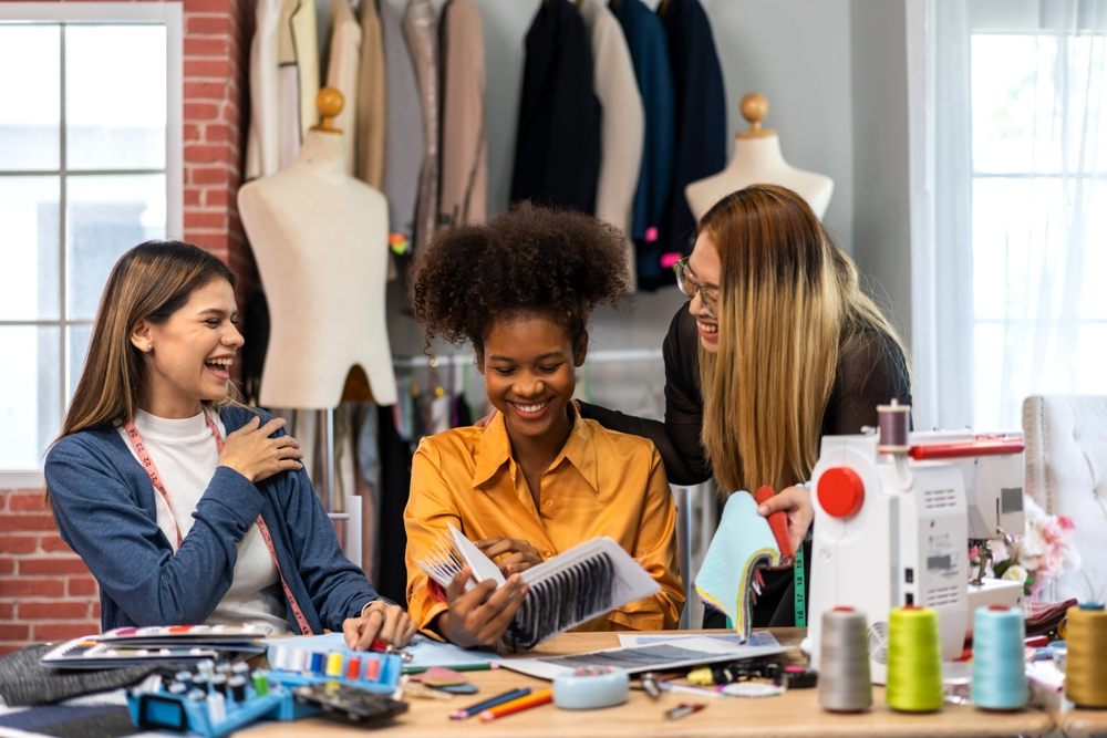 Fabric Design Treasures Supports Inclusive Learning Through Community Partnerships. Collaboration & creativity in fashion design of teamwork, diverse & talented designer collaborating.
