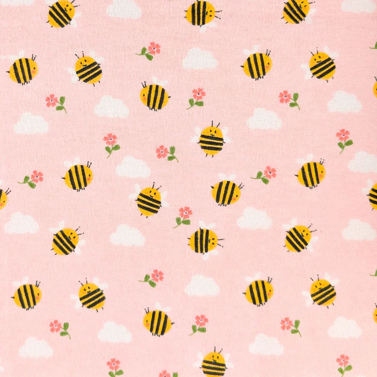 Camelot Fabrics Bumble Bees pink cotton flannel fabric featuring yellow bees, white clouds, and pink flowers from the Fleece and Flannel 2026 Collection.