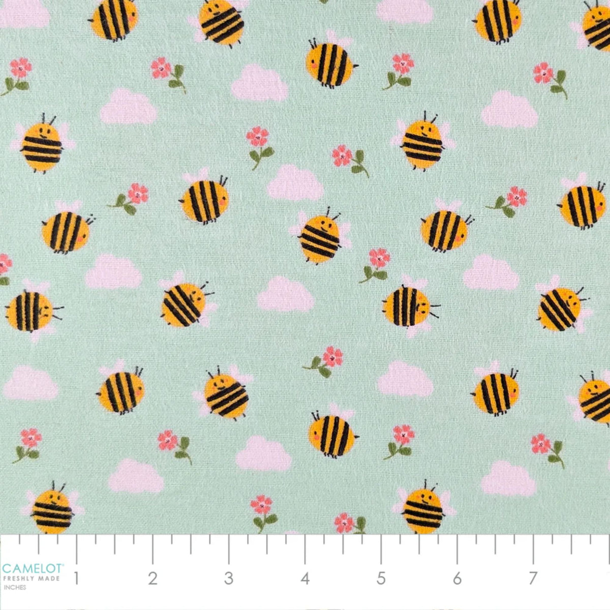 Camelot Fabrics Bumble Bees aqua cotton flannel fabric featuring yellow bees, pink flowers, and fluffy clouds from the Fleece and Flannel 2026 Collection.