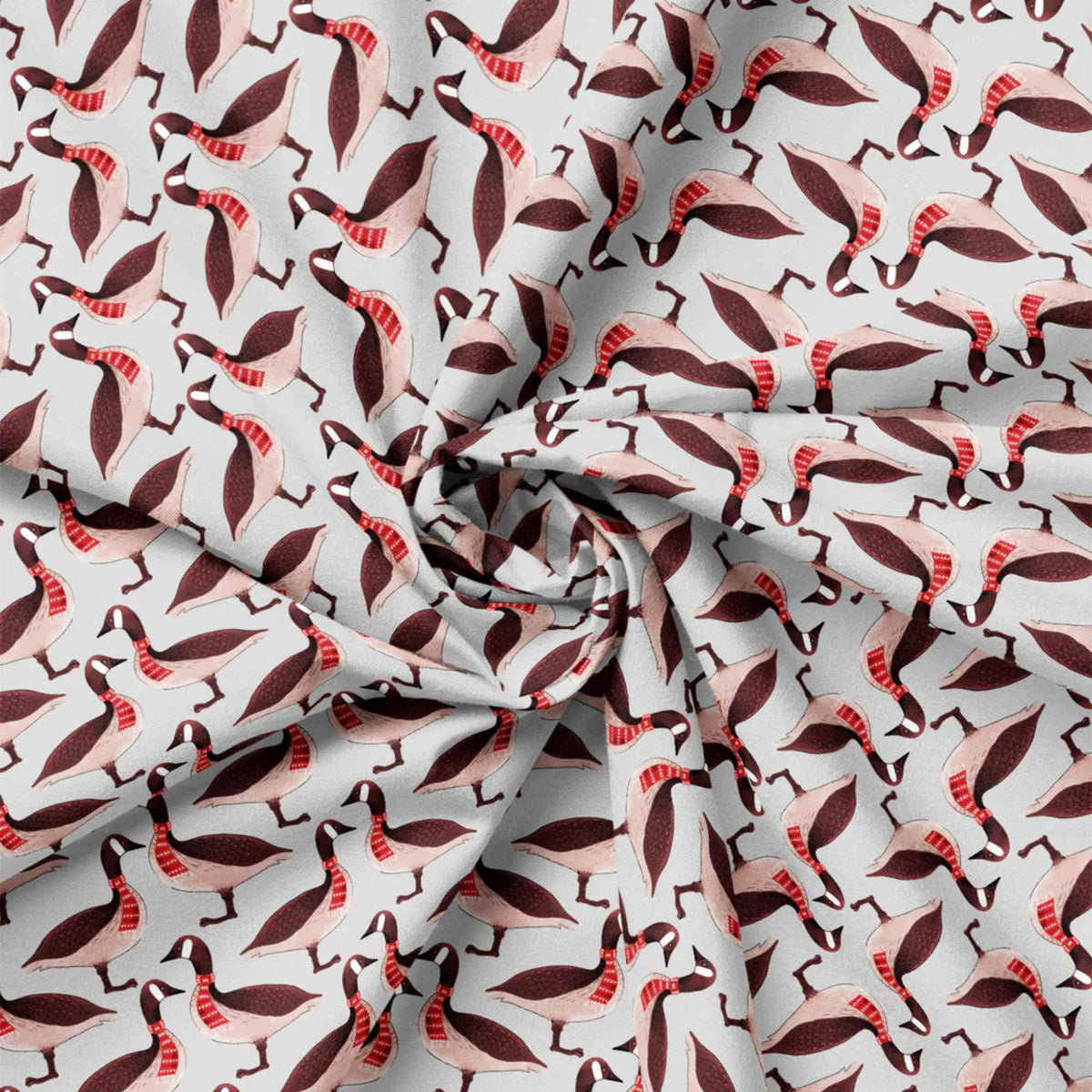 "Canadian geese on grey cotton fabric wearing red patterned scarves by Camelot Fabrics"