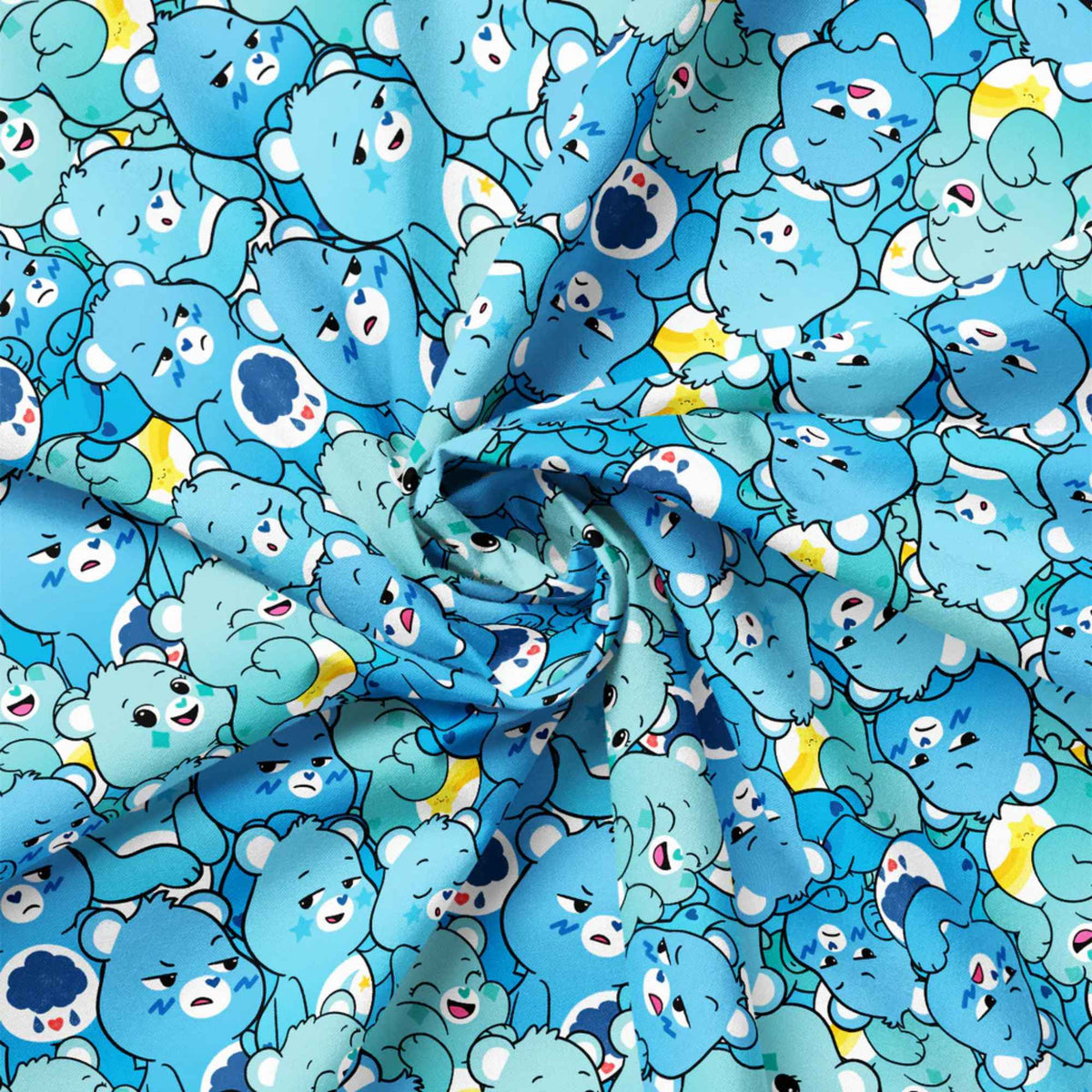 “Licensed Care Bears blue cotton fabric with repeating blue Care Bears characters in various expressions and poses”