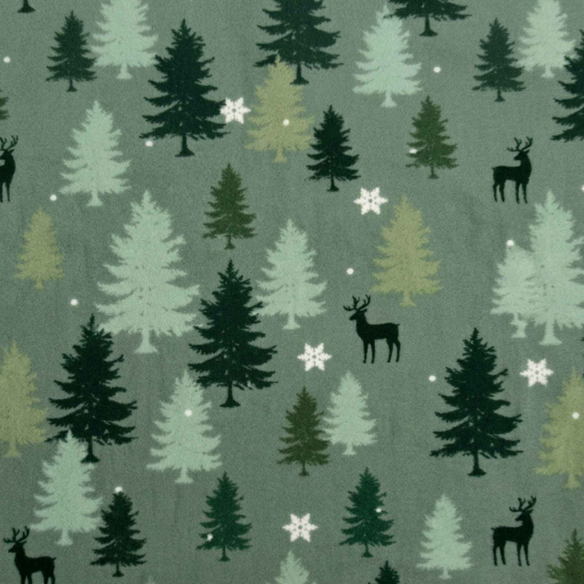 Double brushed flannel fabric featuring evergreen trees, deer silhouettes, snowflakes, and falling snow on a sage green background.