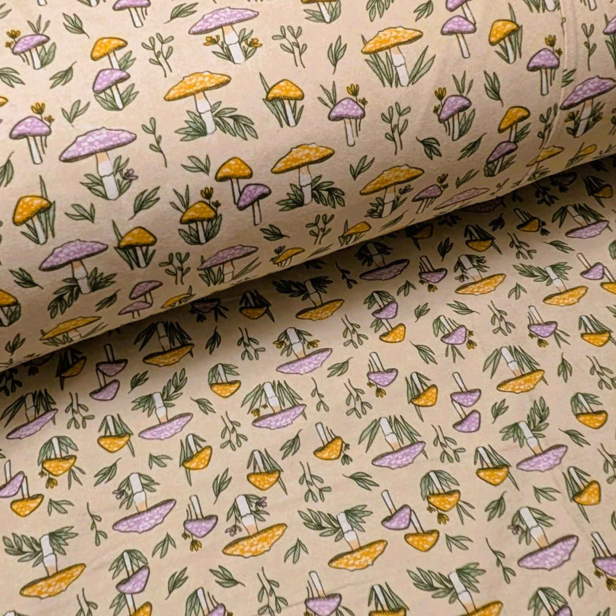 108 inch wide brushed cotton flannel wideback with mushroom and leaf print on cream background for quilt backing