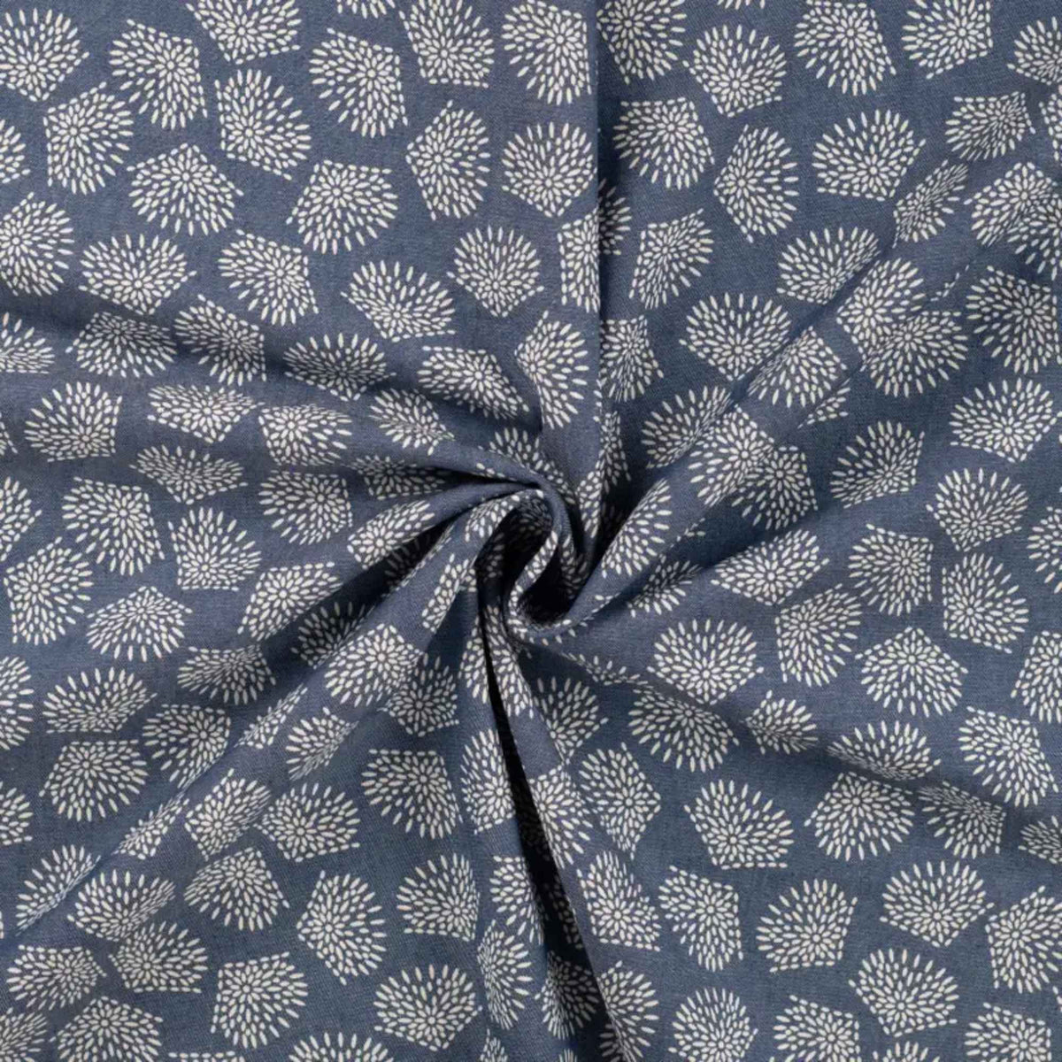 Blue chambray cotton fabric with white leaf print lightweight woven fabric for apparel quilting and sewing projects