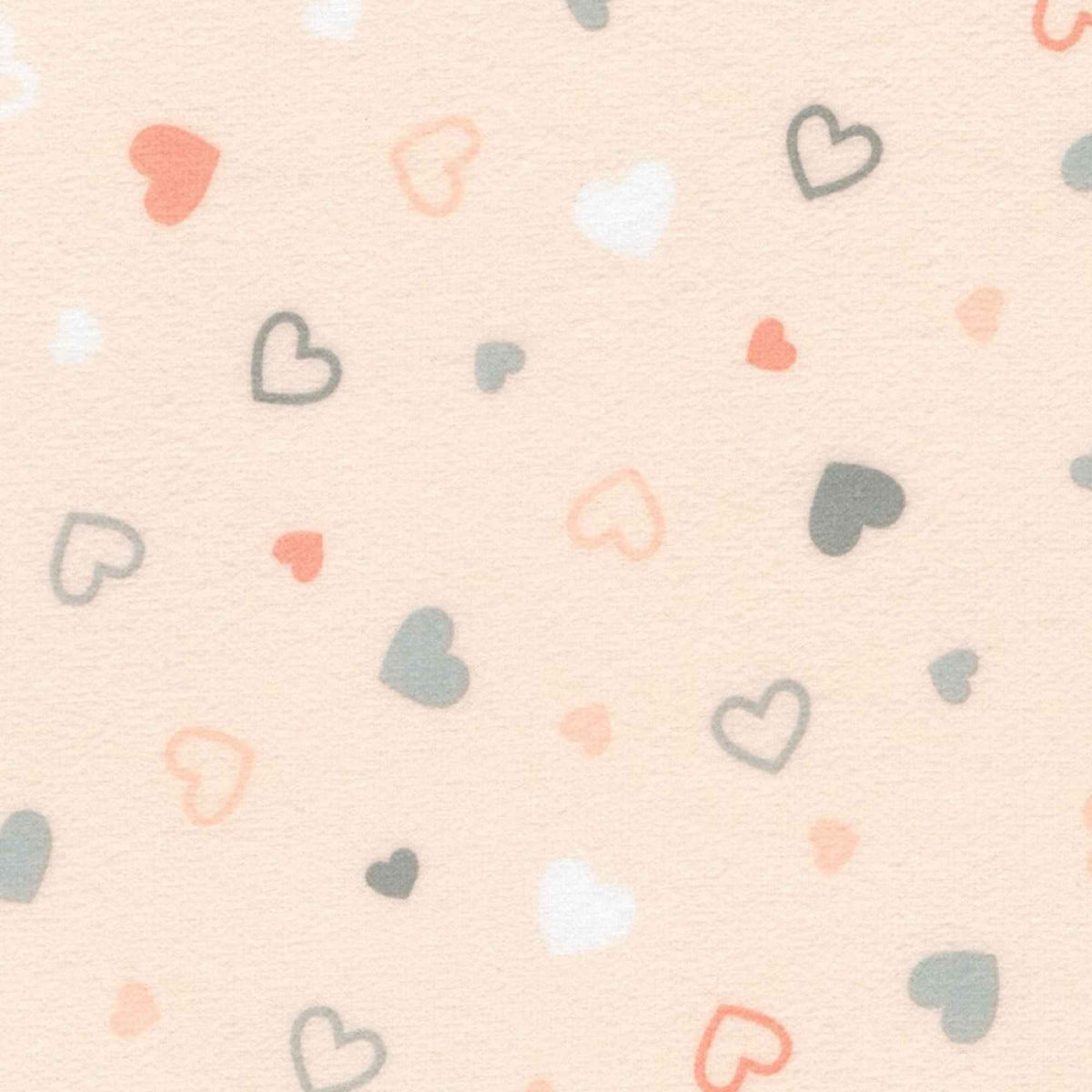 Pearl pink printed cotton flannel fabric with scattered pastel heart design by Robert Kaufman