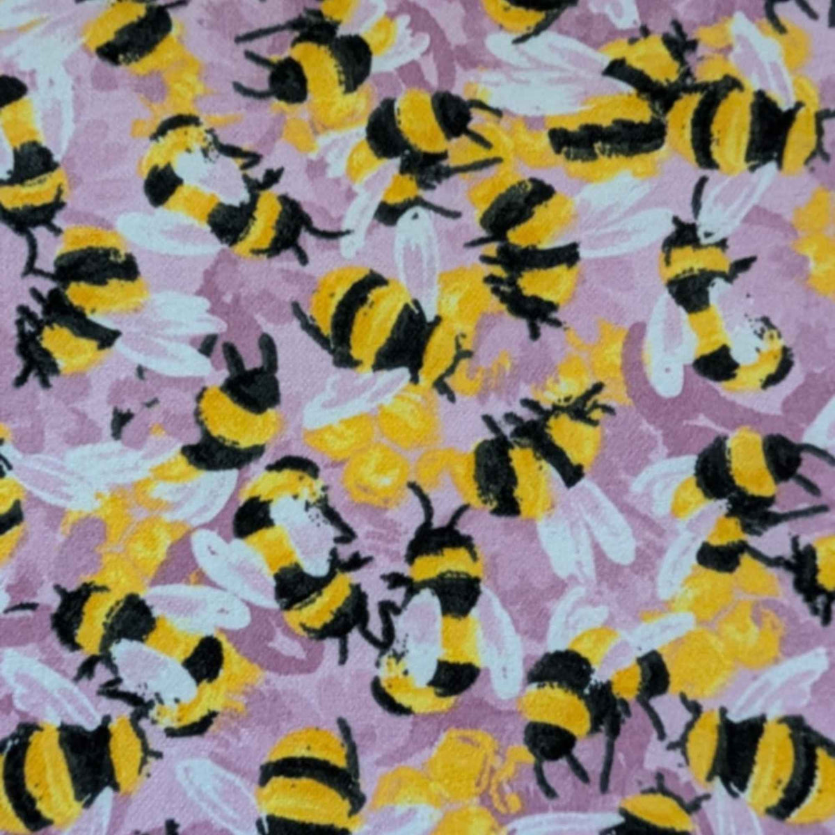 Cotton flannel fabric with yellow and black bees on a pink purple background, brushed for softness, Oeko-Tex certified, 44" wide.