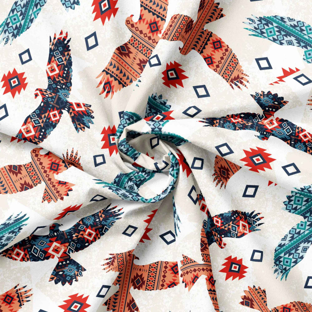 “Cream cotton fabric with multicolored tribal-patterned eagles and geometric motifs.”
