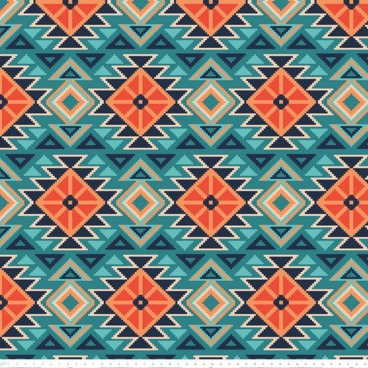 To the Mountains fleece fabric by Camelot, with teal and orange diamonds, navy triangles and cream zigzag detail with ruler for scale.