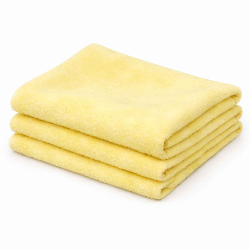 Maize light yellow anti-pill polar fleece fabric folded stack – soft 100% polyester fleece fabric by the yard.