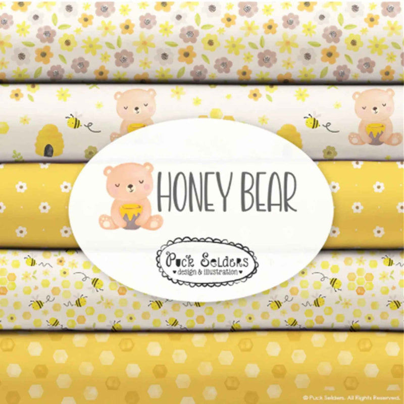 Honey Bear fabric bundle by Camelot Fabrics featuring 10 coordinating quilting cotton prints with bees, florals, daisies, polka dots, honeycomb patterns, and honey bear designs in yellow, peach, cream, and sage green colors