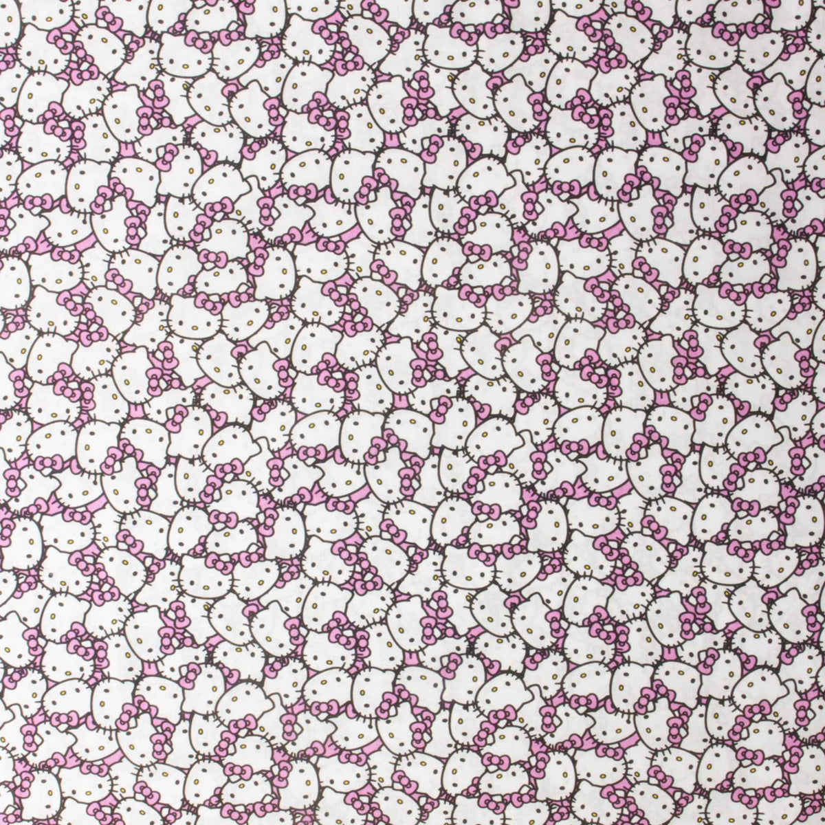 Officially licensed Hello Kitty cotton fabric by Springs Creative featuring an all-over packed print of Hello Kitty faces with pink bows on a soft pink background.