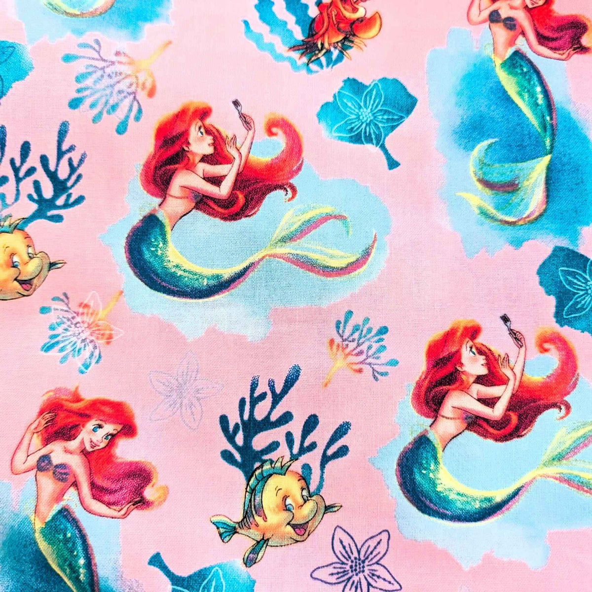 Disney Ariel Little Mermaid cotton fabric with Flounder and Sebastian on pink by Springs Creative CP80606