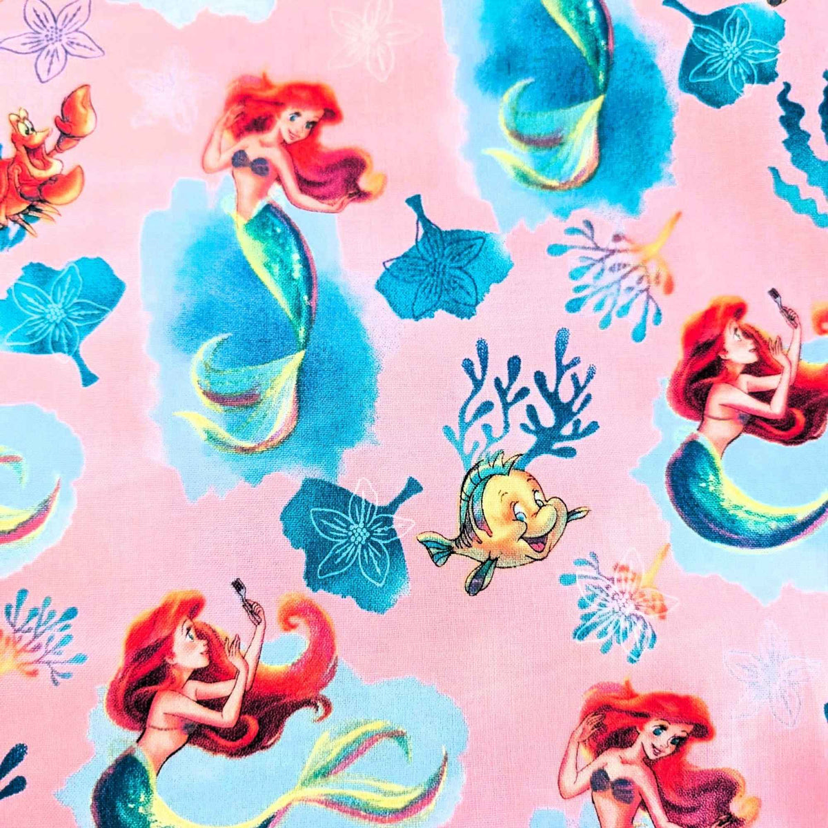 Disney Ariel Little Mermaid cotton fabric with Flounder and Sebastian on pink by Springs Creative CP80606
