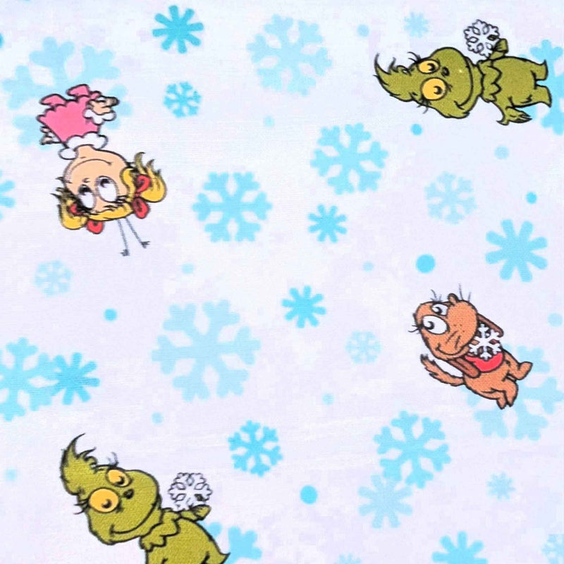 Little Grinch cotton fabric with Grinch characters and aqua snowflakes on white