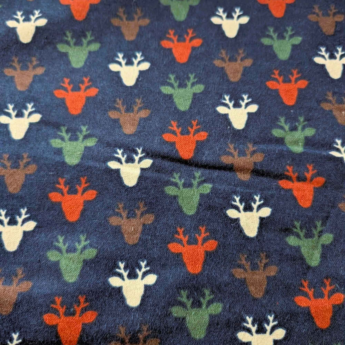 Multi-Colored Deer Heads on Navy Flannel