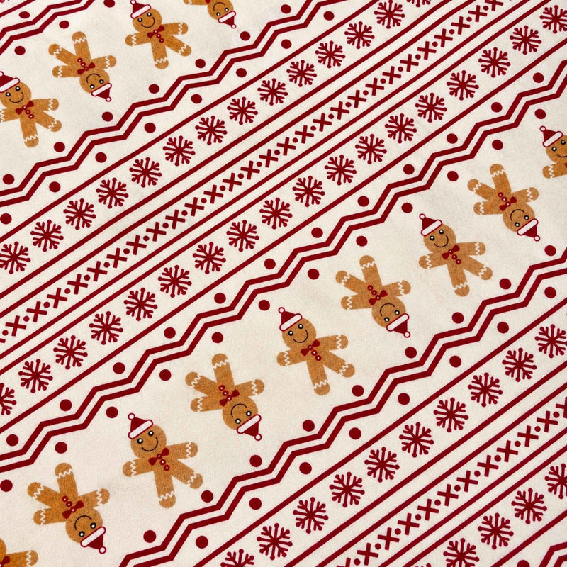 Cream cotton flannel with brown gingerbread figures and burgundy rows of snowflakes, zigzags, dots and geometric stripes.