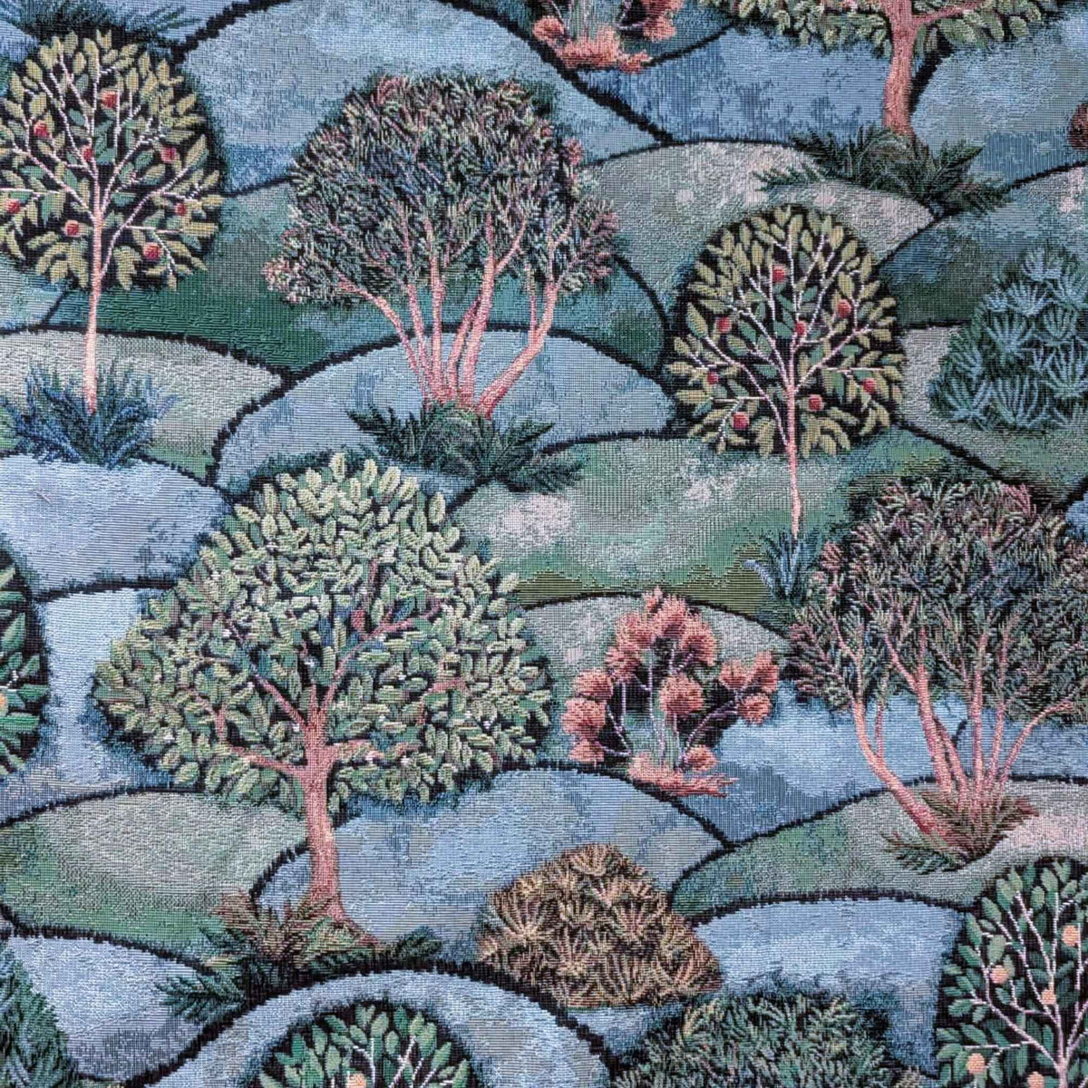 Forest Hill Woodland Trees Gobelin tapestry fabric with leafy trees, muted pink branches and rolling blue and sage green hills.