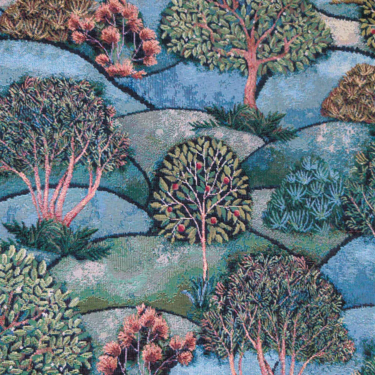 Forest Hill Woodland Trees Gobelin tapestry fabric with leafy trees, muted pink branches and rolling blue and sage green hills.