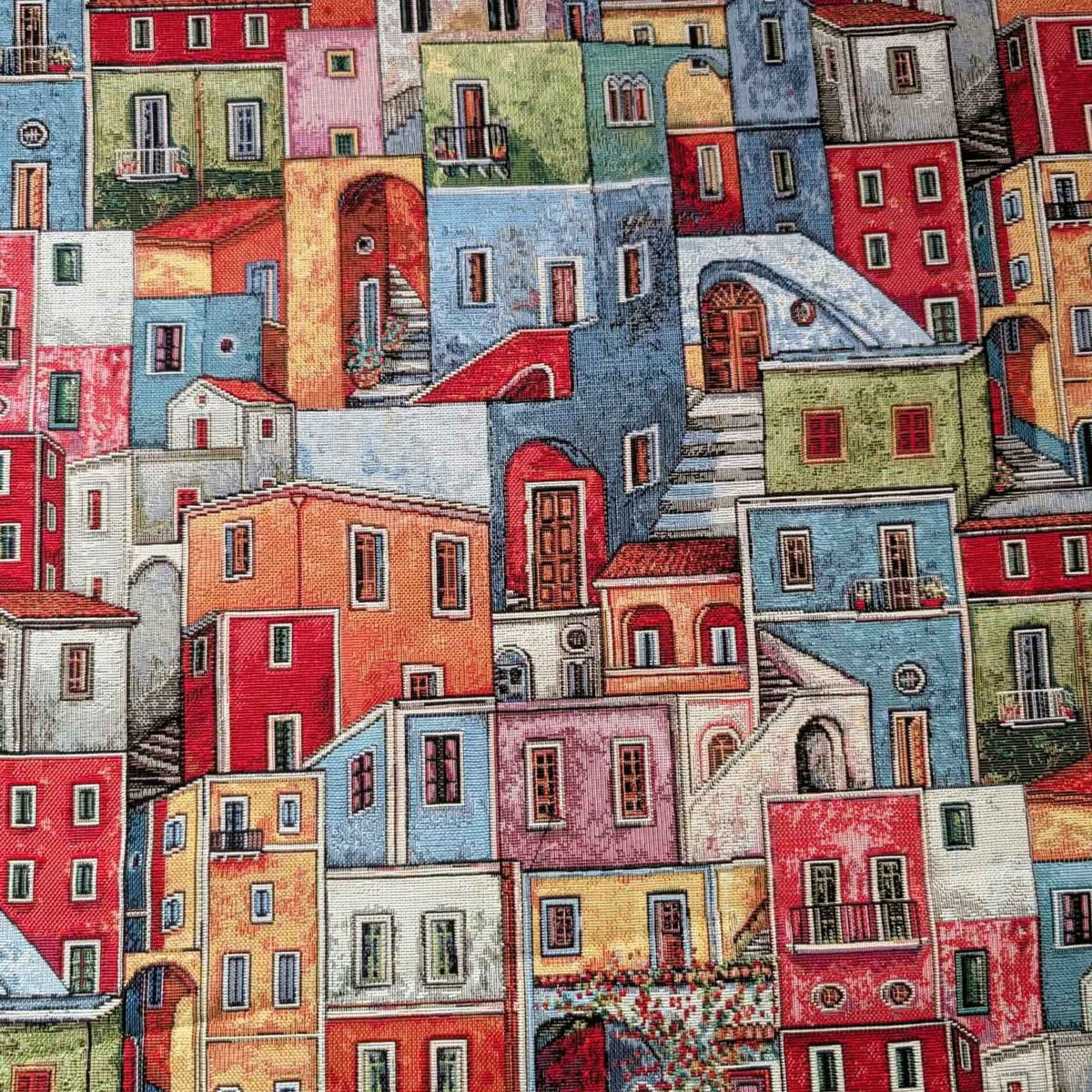 Mediterranean village Gobelin tapestry fabric featuring colourful houses, tiled roofs, balconies, arched doorways and winding stairways.