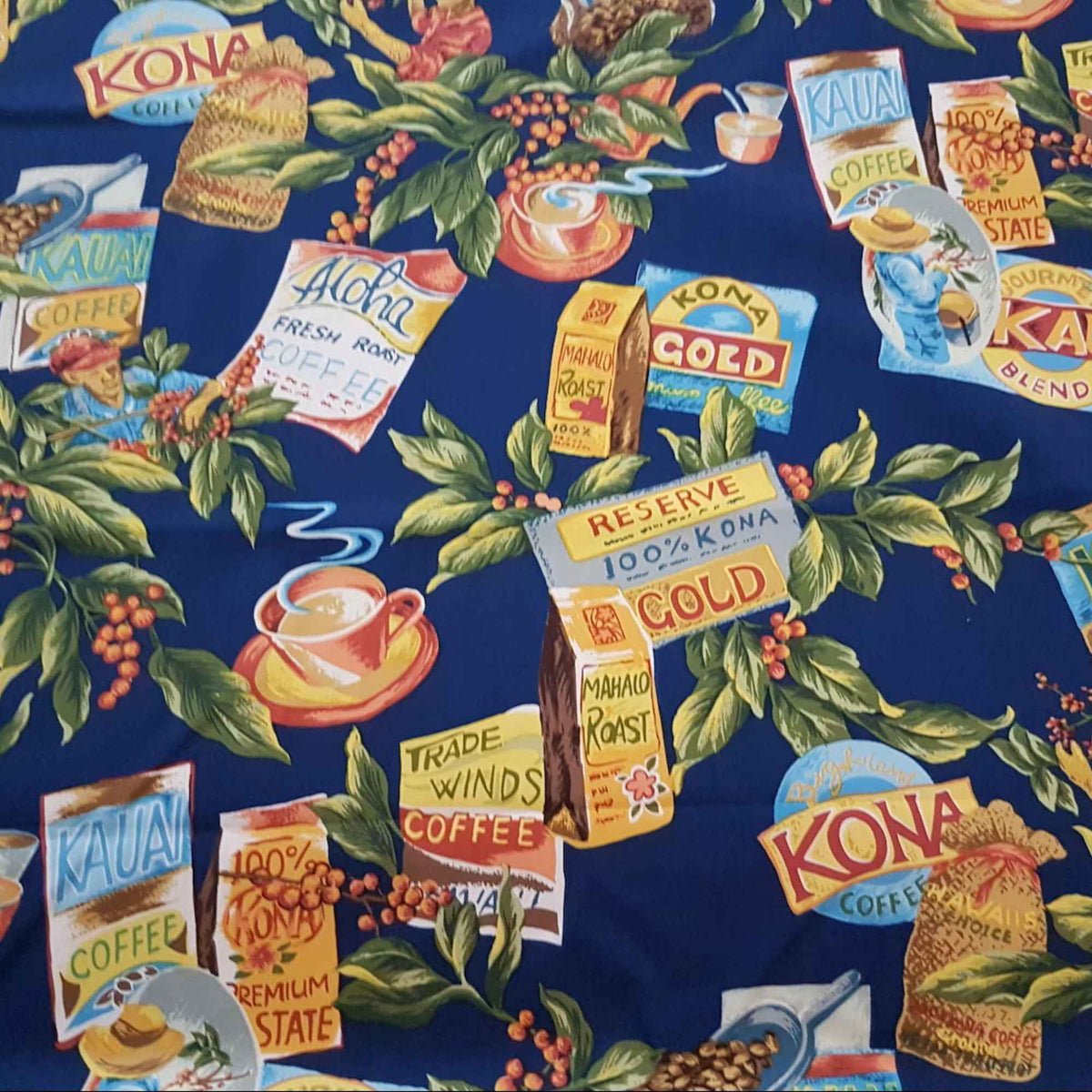 Kauai Kona Coffee Hawaiian cotton fabric featuring vintage coffee labels, coffee beans, tropical leaves and coffee cups on navy blue background