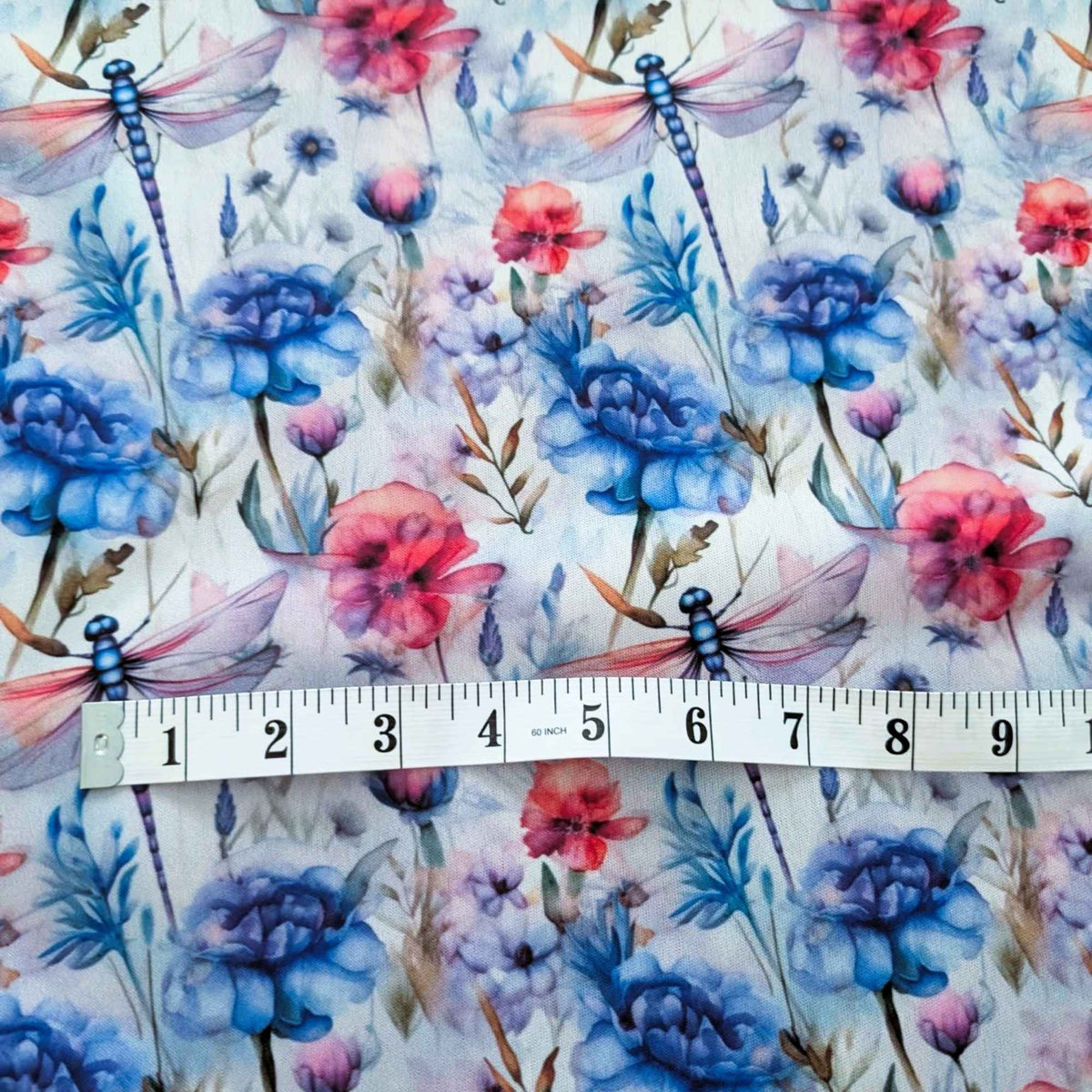 Watercolour Dragonfly Garden exclusive waterproof PUL fabric with blue dragonflies and blue, coral and lavender flowers on white