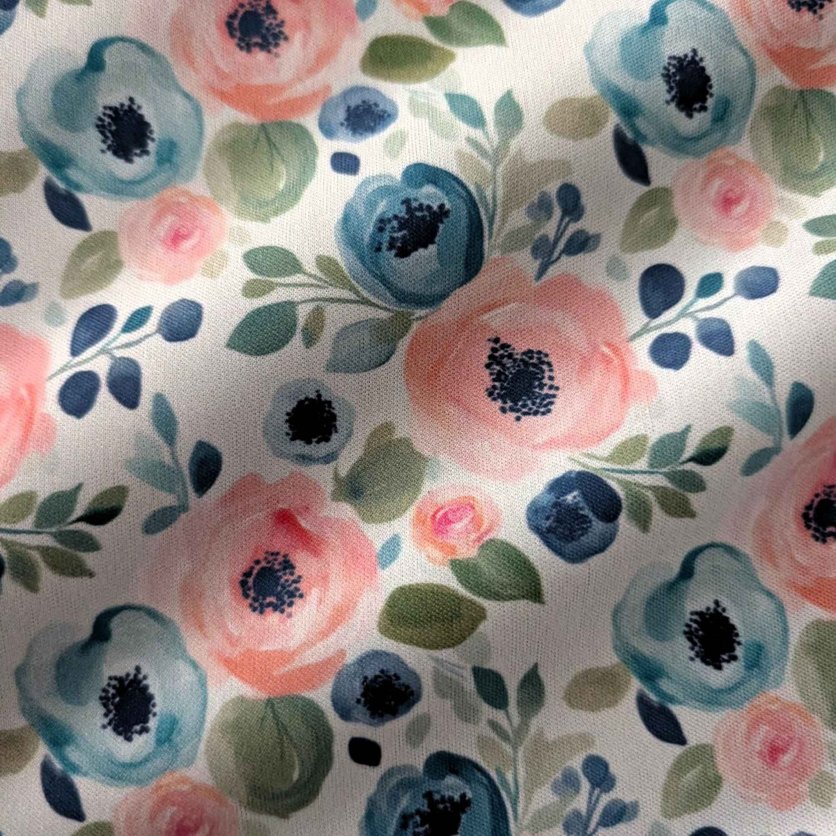 Blush and Blue Watercolour Blooms exclusive waterproof PUL fabric with pink and blue flowers and green leaves on teal