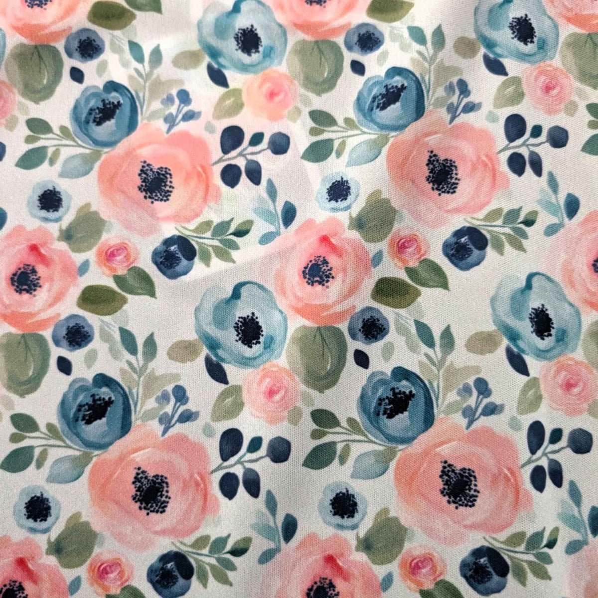 Blush and Blue Watercolour Blooms exclusive waterproof PUL fabric with pink and blue flowers and green leaves on teal
