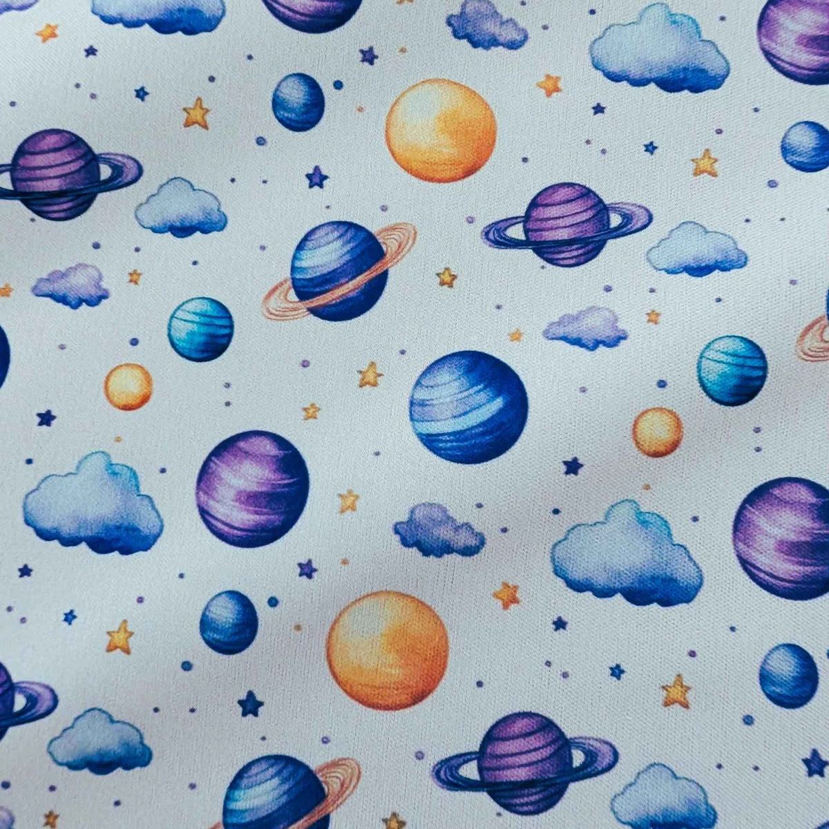 Dreamy Watercolour Planets and Clouds exclusive waterproof PUL fabric with colourful planets, blue clouds and stars on White