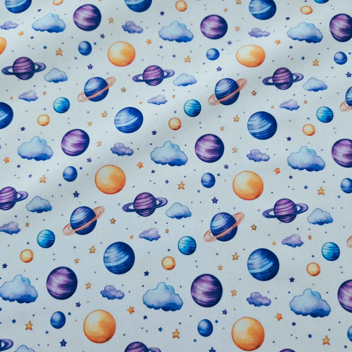 Dreamy Watercolour Planets and Clouds exclusive waterproof PUL fabric with colourful planets, blue clouds and stars on White