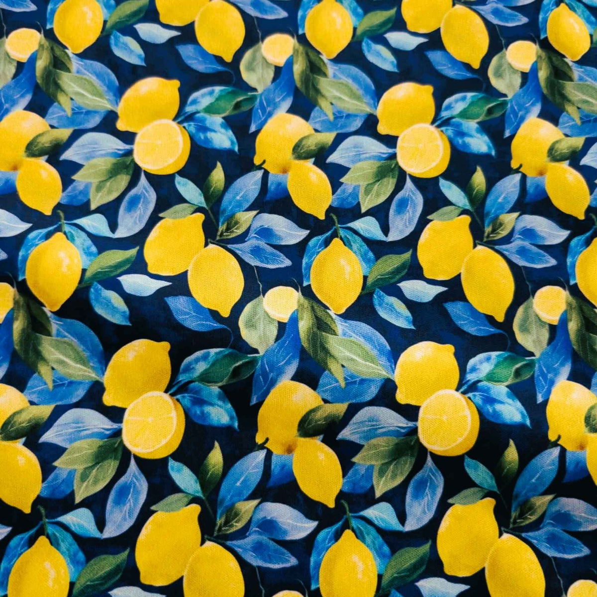 Sunlit Lemons on Navy exclusive waterproof PUL fabric with bright yellow lemons and blue-green leaves on a navy background