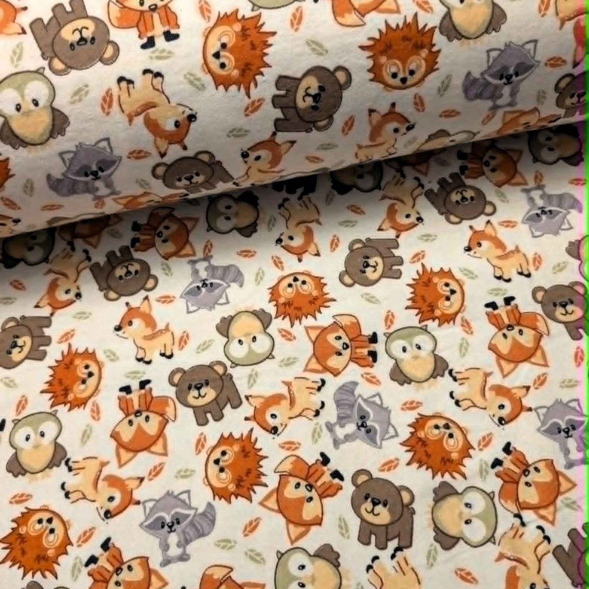 Double brushed flannel fabric featuring foxes, owls, bears, raccoons, deer, and hedgehogs on a cream woodland background.