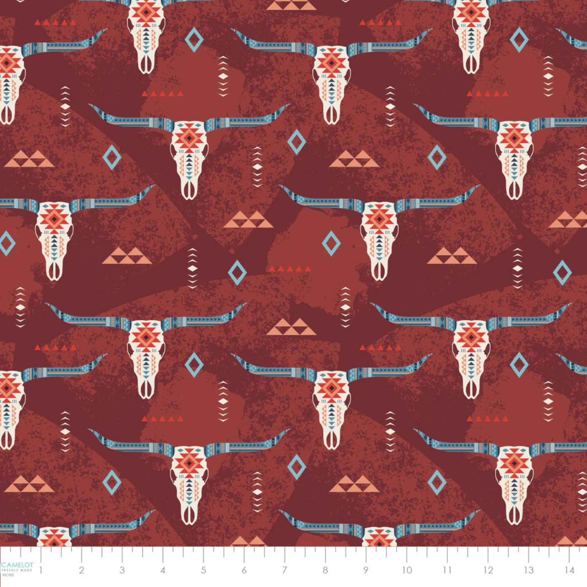 “Rust-colored cotton fabric with Southwestern longhorn skull motifs and tribal geometric accents.”