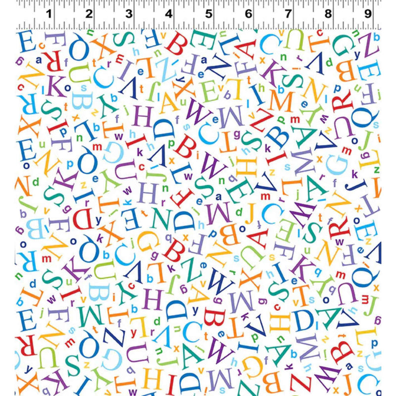 “Colorful scattered alphabet letters in various sizes printed on a white cotton fabric background.”