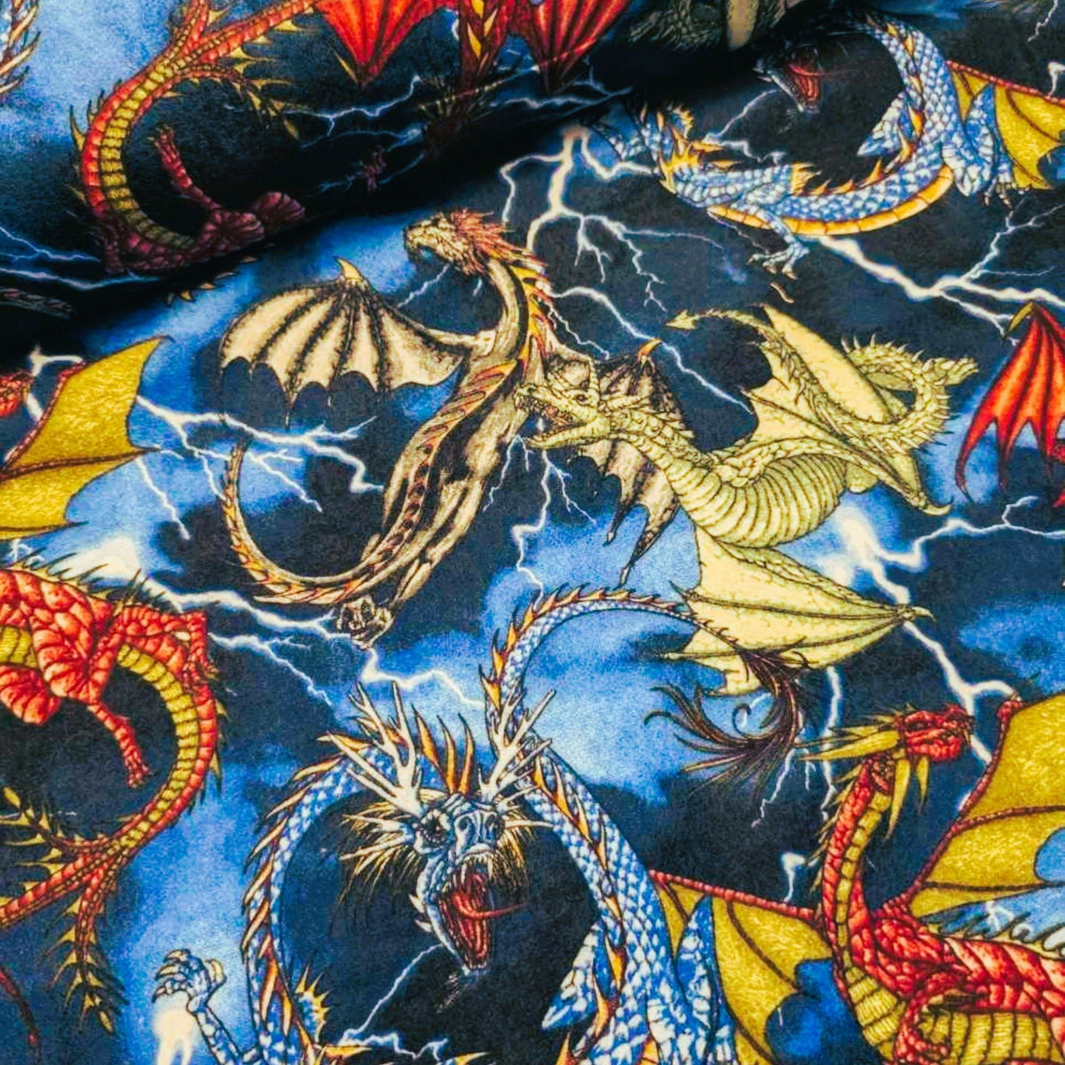 Colorful Dragons Cotton Flannel – Fantasy Creatures on Lightning Sky
