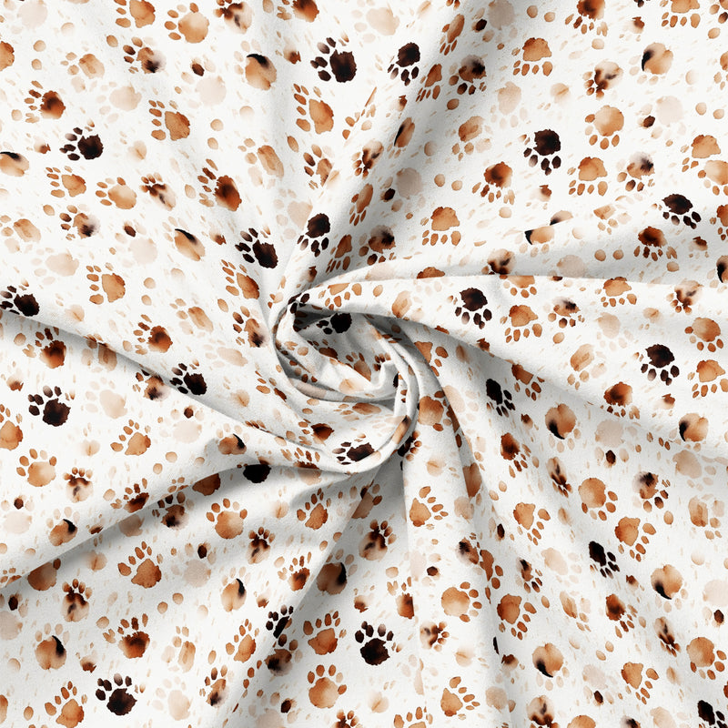 Draped close-up of Paw & Whisker Paw Prints quilting cotton print.