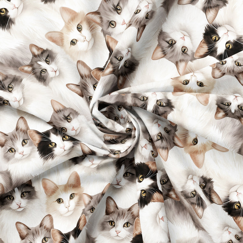 Draped close-up of Paw & Whisker Cat Faces quilting cotton print.