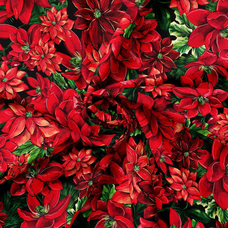Detail view of Joy to the World Poinsettia Blooms on Black quilting cotton showing print scale and drape.