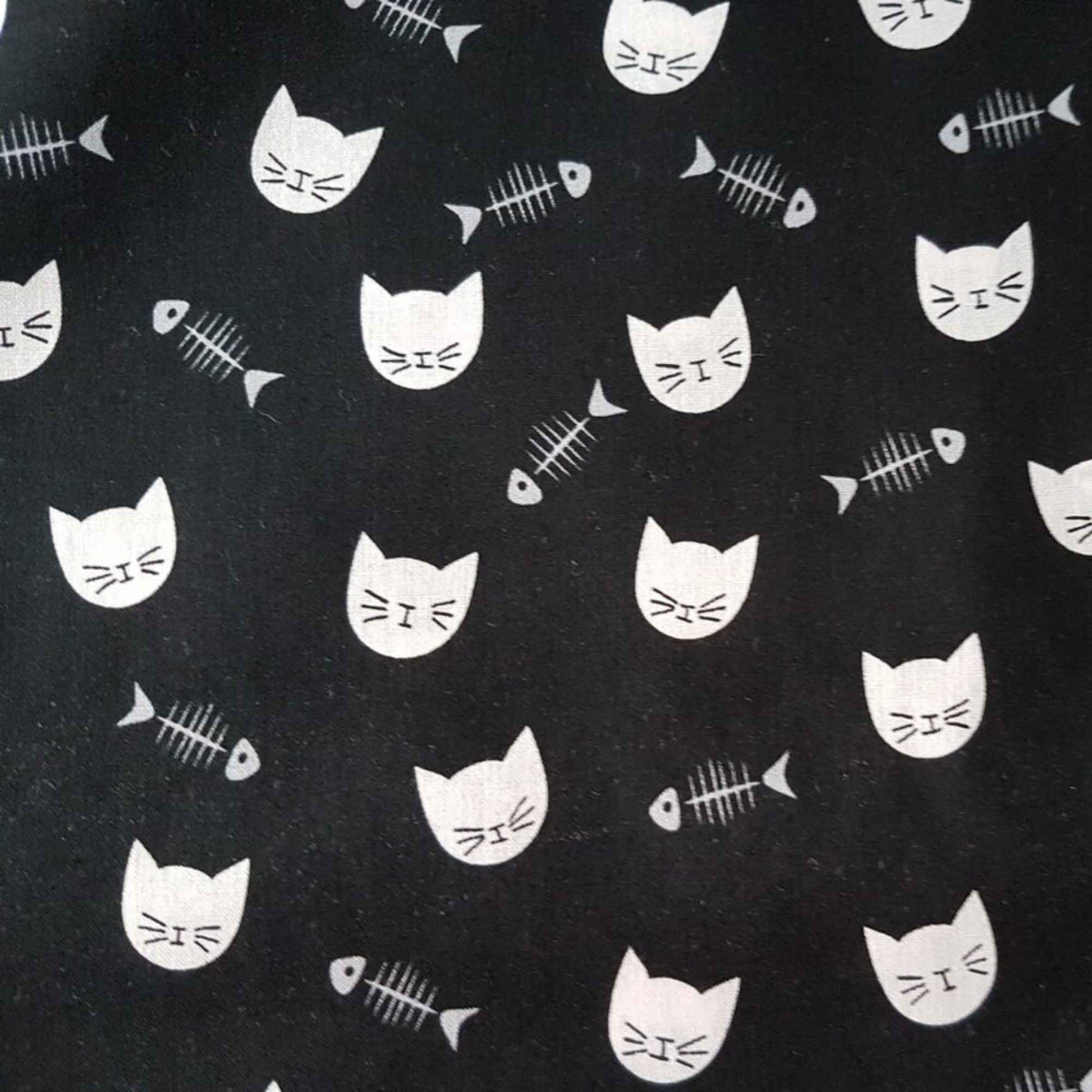 White Cat Faces & Fishbones on Black Cotton Fabric