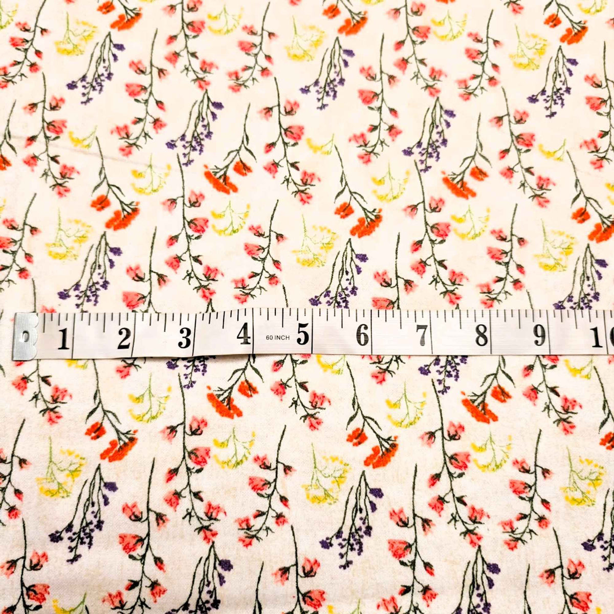108 inch wide brushed cotton flannel wideback with wildflower print on cream background for seamless quilt backing