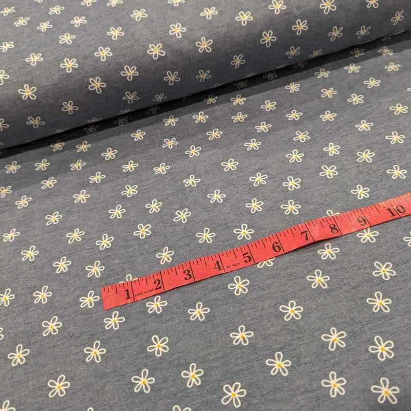 Daisy Flower FLANNEL Fabric on a Blue Denim Background