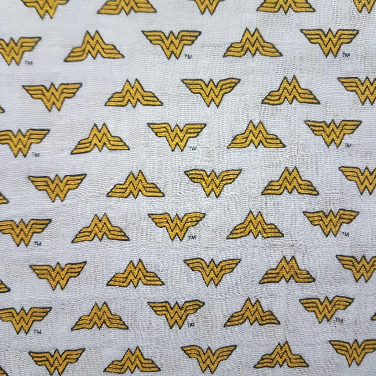 Wonder Woman Emblem on White Double Gauze | Fabric Design Treasures